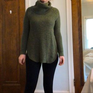 Green knit turtleneck sweater, size S.
